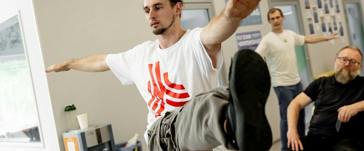 Group of men practicing stability and coordination exercises